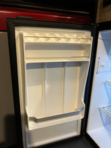 RV rental: Bright, clean mini-fridge interior. Door features built-in storage for eggs and bottles, ready for your adventure.