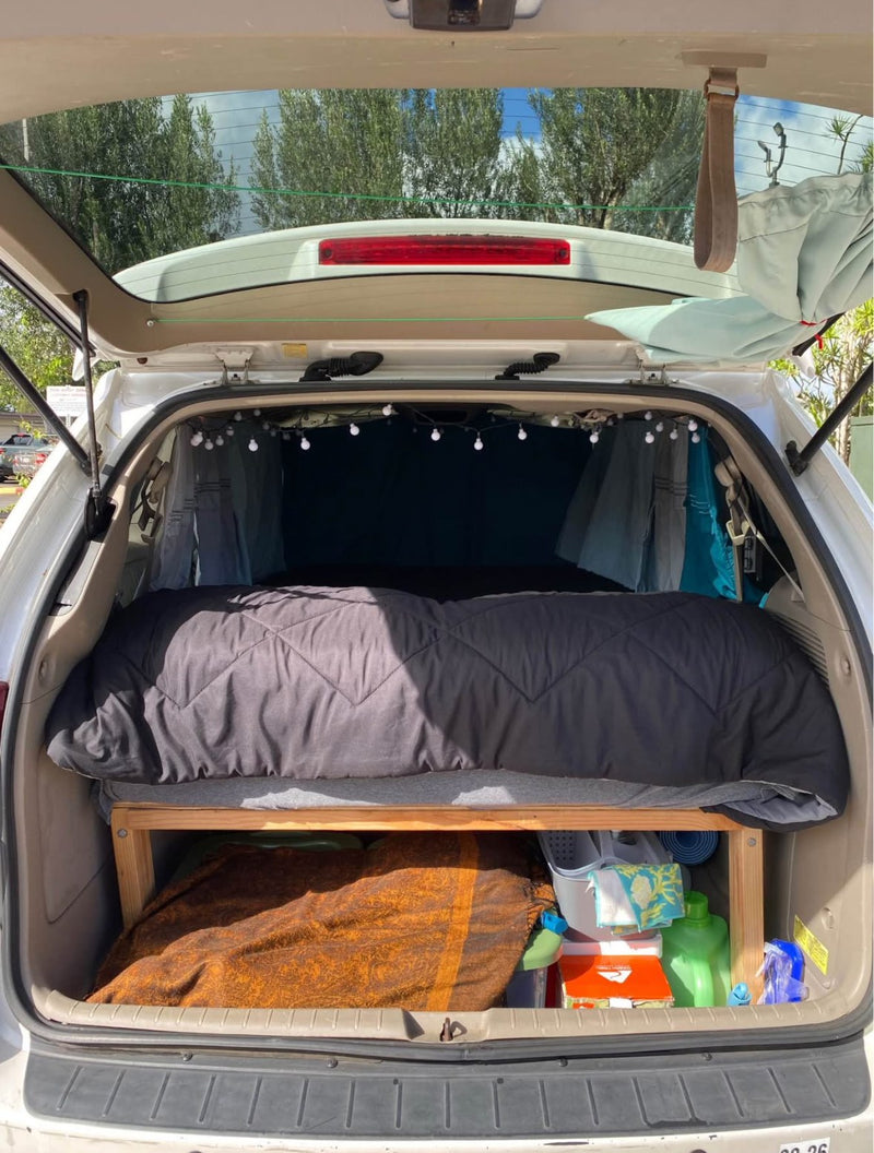  and curtains.|Experience mobile living! This RV rental features a cozy bed — photo 6