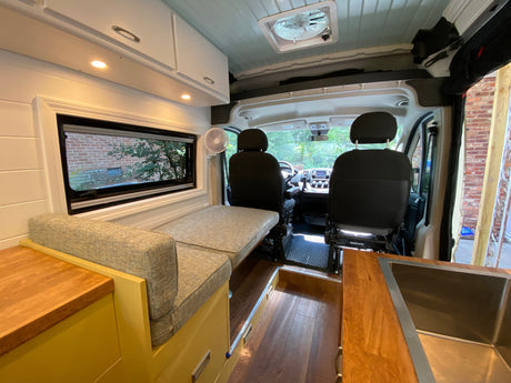  and overhead storage.|Bright RV rental interior: comfy bed
