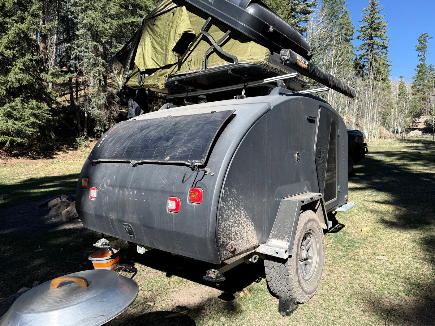 Explore the outdoors with this Escapod RV rental! Features an off-road teardrop trailer, rooftop tent, and solar power.