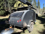 Explore the outdoors with this Escapod RV rental! Features an off-road teardrop trailer, rooftop tent, and solar power.