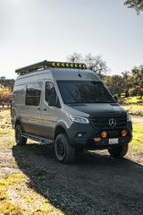 Gray Mercedes-Benz Sprinter camper van, modified for overland travel, ideal for an RV rental.