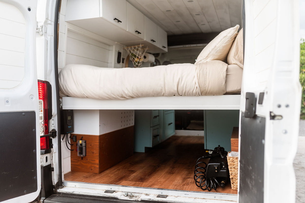  and cozy bed.|Inside an RV rental: a black faucet — photo 8