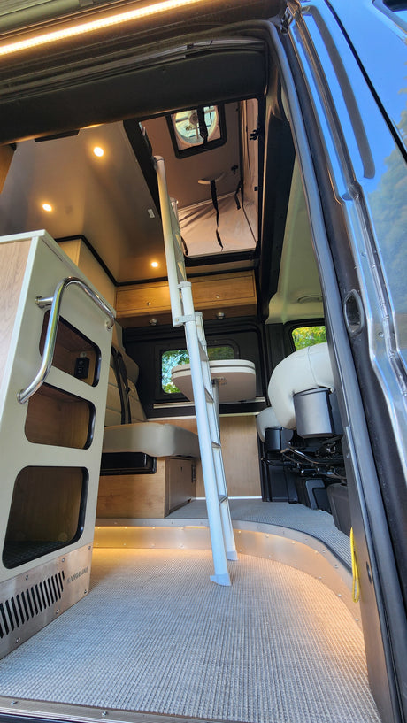 Experience luxury mobile living in this rv rental. A bright camper van interior with dynamic lighting & versatile layout.