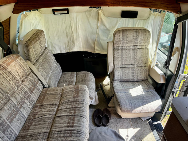  and a compact kitchen area.|Cozy rv rental interior featuring a compact kitchen — photo 5