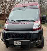 Front view of a rugged maroon and black Ram ProMaster van, perfect for your next RV rental adventure.