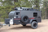 This grey InTech Flyer off-road rv rental is an adventure trailer with solar & rugged tires for camping.