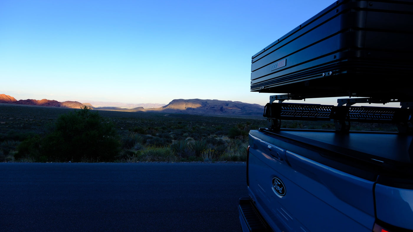 Sunrise over desert mountains, viewed from a Ford pickup with a Roofnest rooftop tent. Great alternative to an RV rental for outdoor adventures. — photo 18