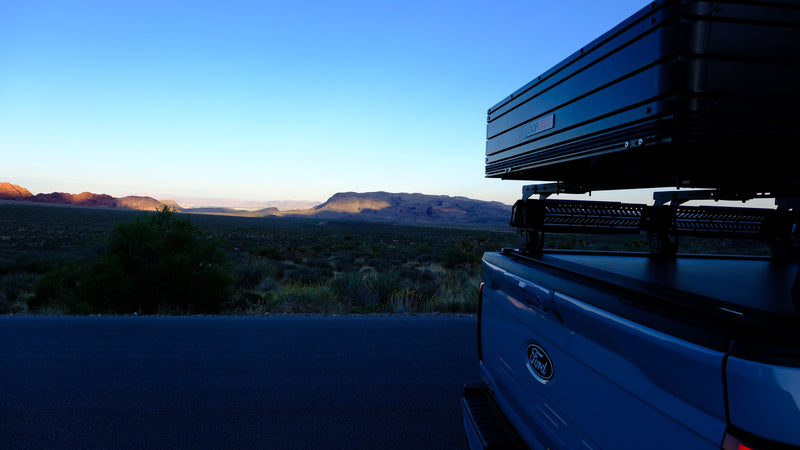 Sunrise over desert mountains, viewed from a Ford pickup with a Roofnest rooftop tent. Great alternative to an RV rental for outdoor adventures. — photo 18