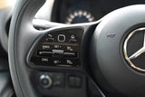 RV rental steering wheel detail: Cruise control buttons (SET+, SET-, RES, CNCL) and multimedia controls are clearly visible.