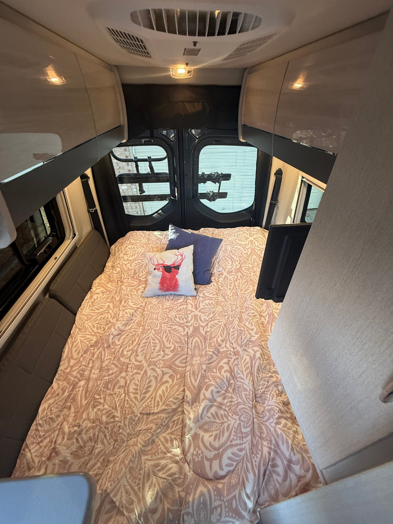  and cup holders.|Interior of an RV rental: Wide view of the spacious front cabin with dashboard — photo 7