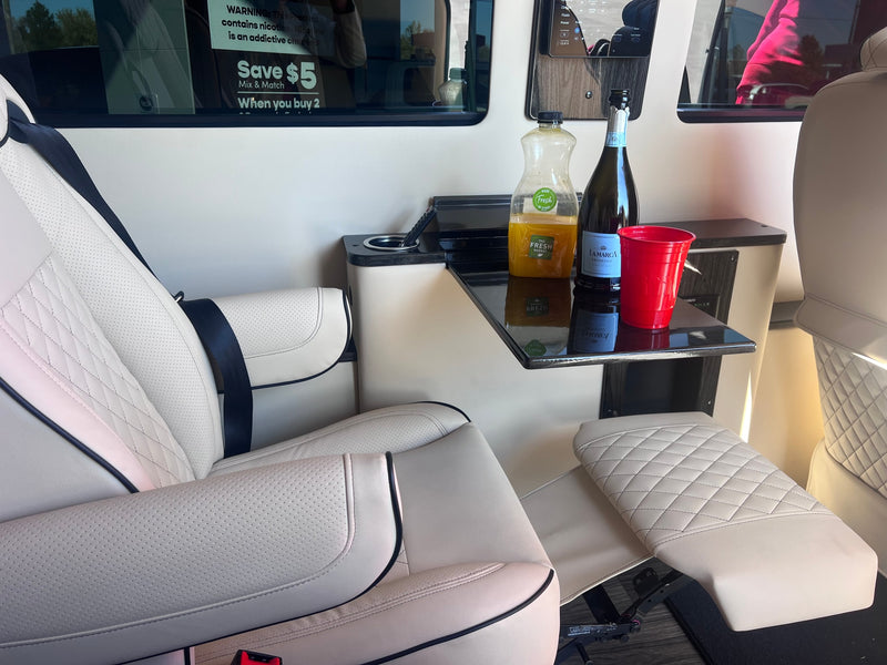  and protected seats.|Spacious RV rental interior: view of driver's cabin with cream-colored luxury seats — photo 18