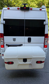 White Ram ProMaster rv rental van, showcasing its rear exterior with tinted windows and a spacious cargo box.