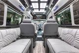 Luxury rv rental interior: spacious cabin, plush seating, entertainment screen, and ambient lighting for comfortable travel.