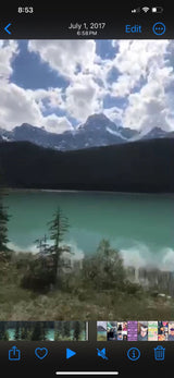 Picture an RV rental trip to this serene turquoise lake with majestic mountains under a cloud-filled sky. Perfect nature escape.