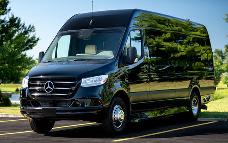 This sleek black Mercedes Sprinter van, ready for RV rental, shines under the sun. Ideal for luxury travel.