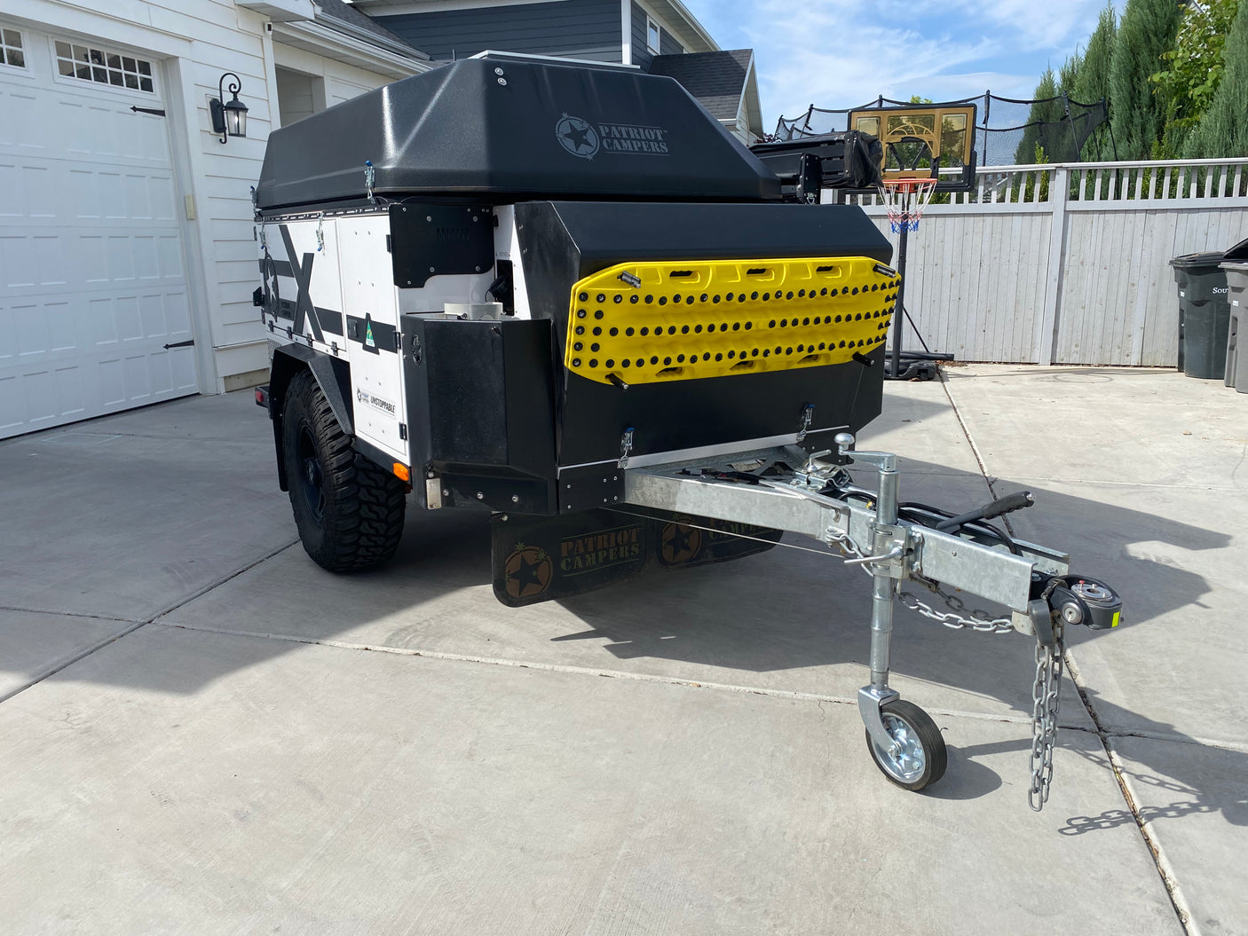 Black & white Patriot Campers off-road camper trailer, ready for rv rental. Great for overlanding adventures!