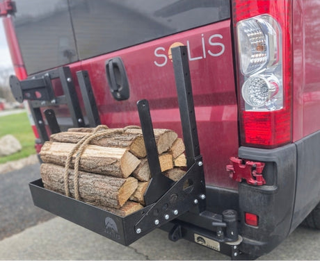 Winnebago Solis RV rental van with rear-mounted Arktys cargo carrier packed with firewood, ready for adventure.