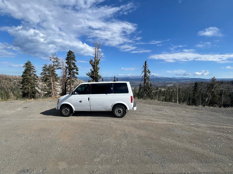  showcasing a vast forested mountain landscape under a bright blue — photo 2
