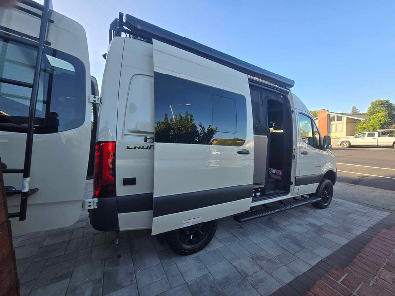  and front seat.|This RV rental features a compact shower with a bamboo slatted mat — photo 15