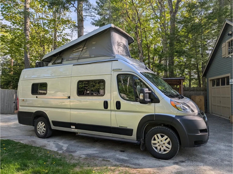 A light silver pop-top camper van — photo 1