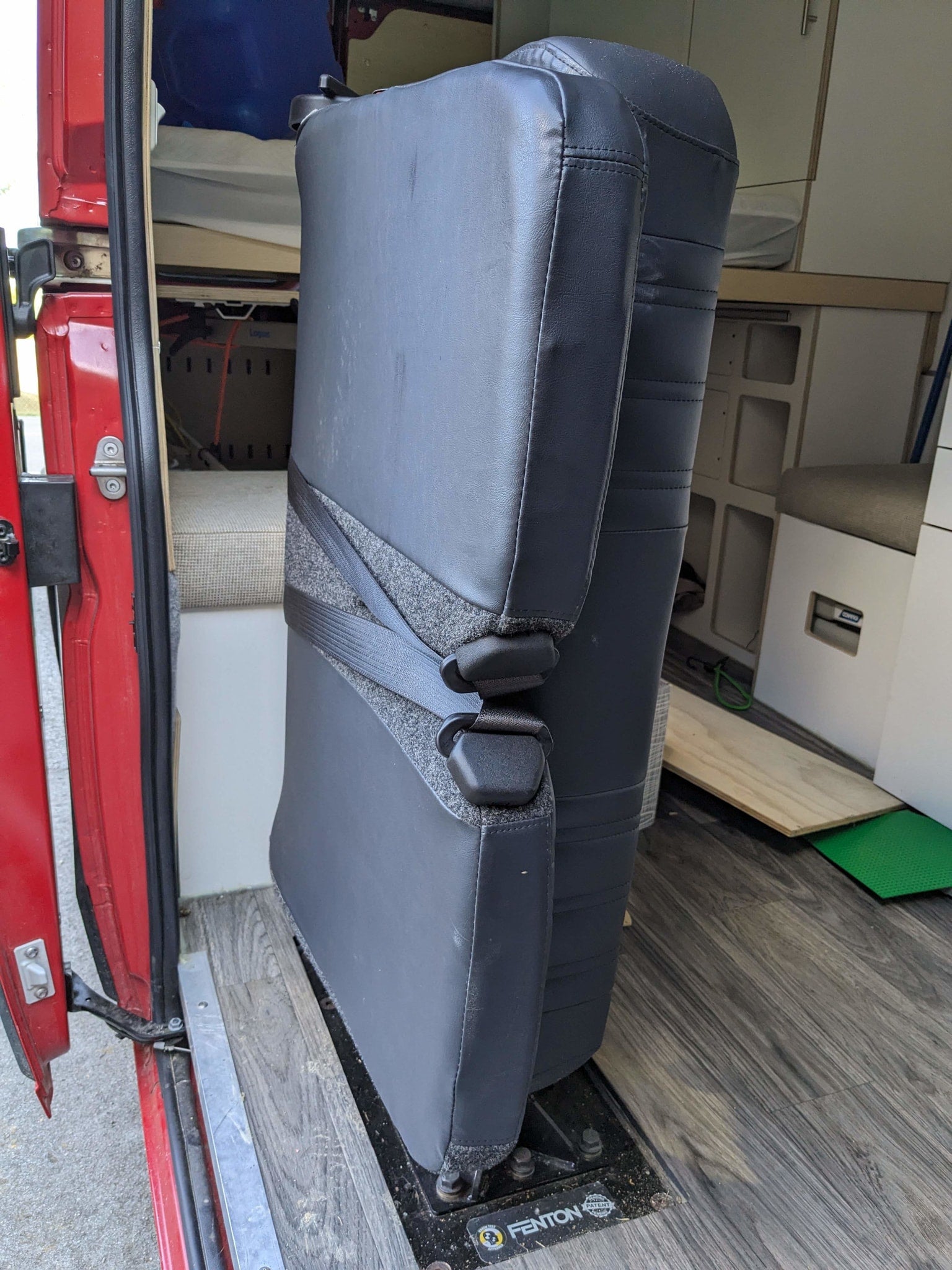  and essential amenities.|Comfortable bed inside a modern rv rental camper van