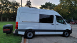 White Sprinter-style camper van, an ideal RV rental, featuring a rear storage box.