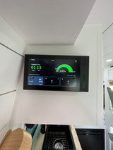 In an rv rental, an EcoFlow power monitor displays 100% battery (5kWh) with 1 day, 13 hours of available runtime, at 69.8°F.