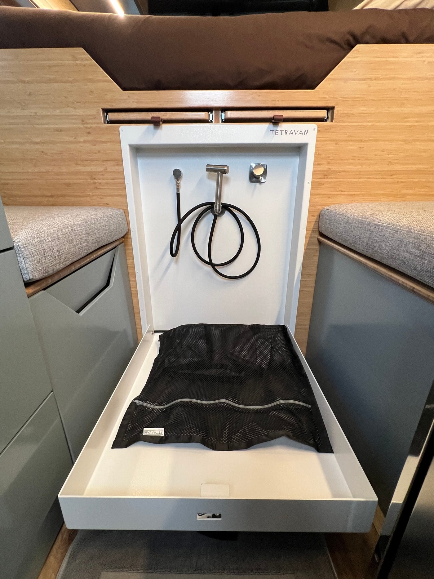  revealing a modern custom interior. Parked at Scenic RV Rentals.|Step inside this custom rv rental camper van! Features a sleek kitchenette — photo 4