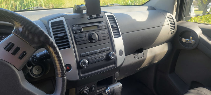 Interior of a vehicle dashboard with steering wheel and controls, ideal for an RV rental road trip adventure. — photo 7