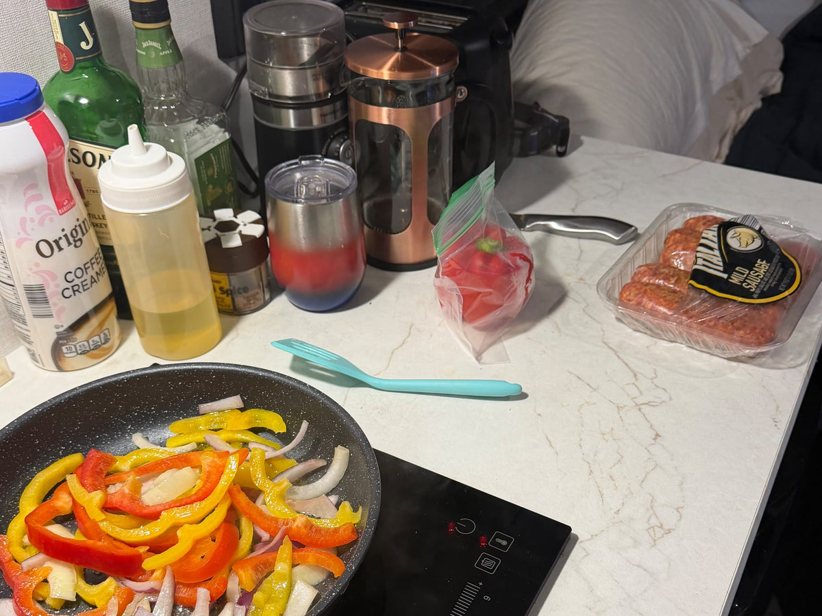  with coffee and spices nearby.|This compact Coleman travel trailer RV rental — photo 3