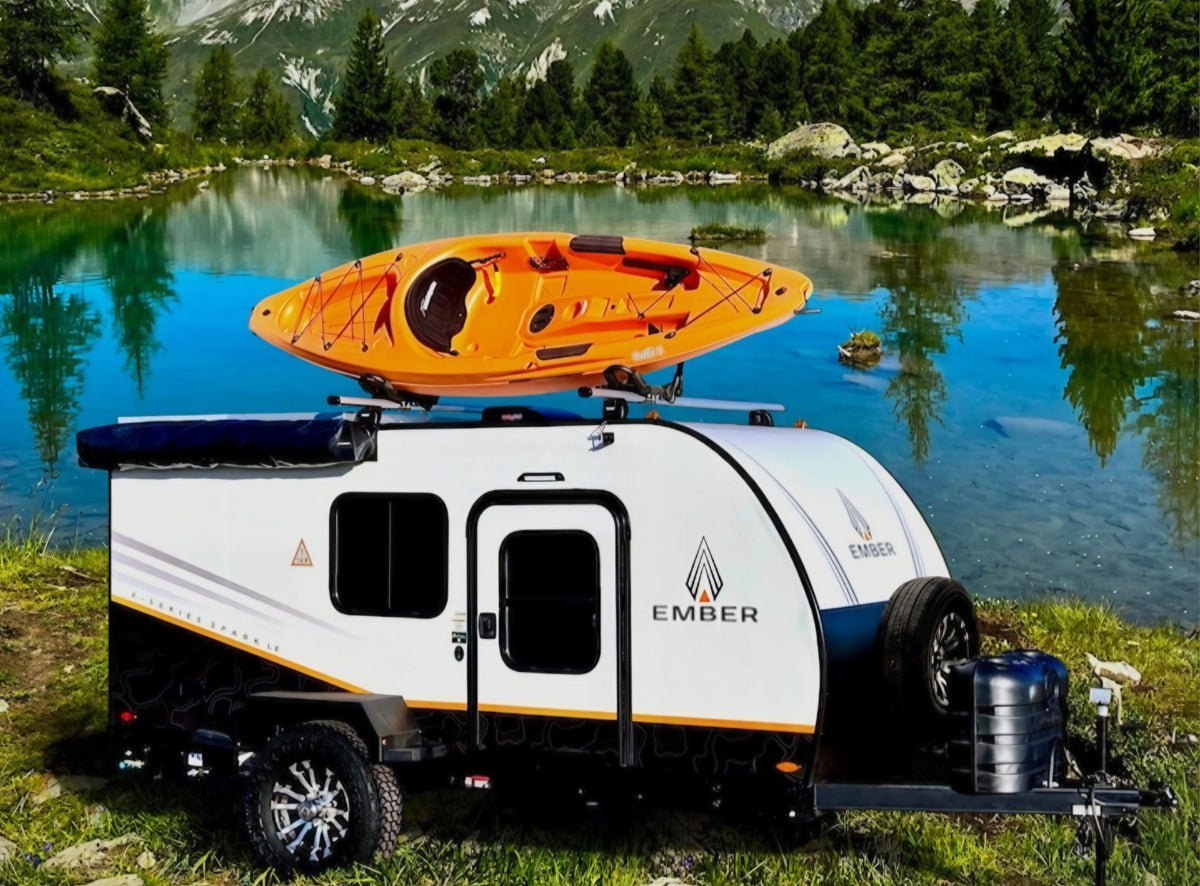 Explore nature with this RV rental! Ember teardrop trailer & kayak by a stunning mountain lake. Ideal for an adventurous getaway.
