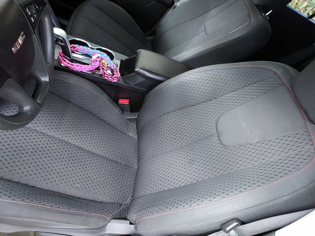 GMC vehicle interior with dark fabric seats, steering wheel, & console. Comfortable, great for an RV rental trip.