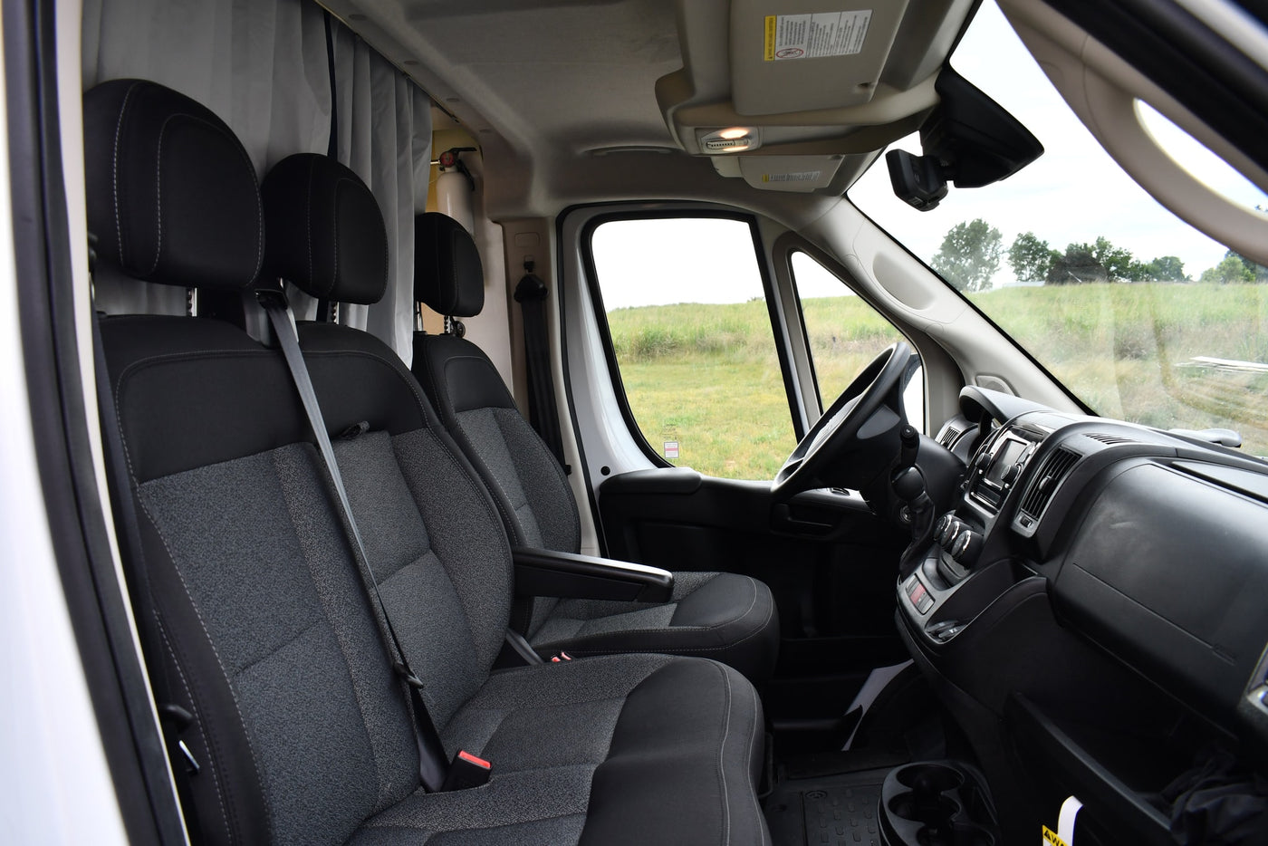  parked on gravel.|White Ram Promaster van — photo 8