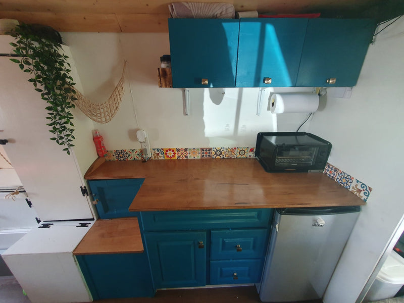  ready for adventure.|Step inside this cozy RV rental camper van! Features a warm wooden interior — photo 6