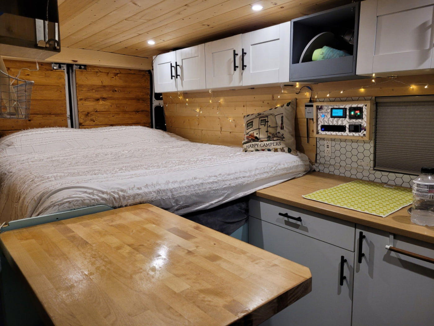  revealing a compact kitchen and living area inside.|Experience mobile living in this RV rental! Features a compact kitchen — photo 8
