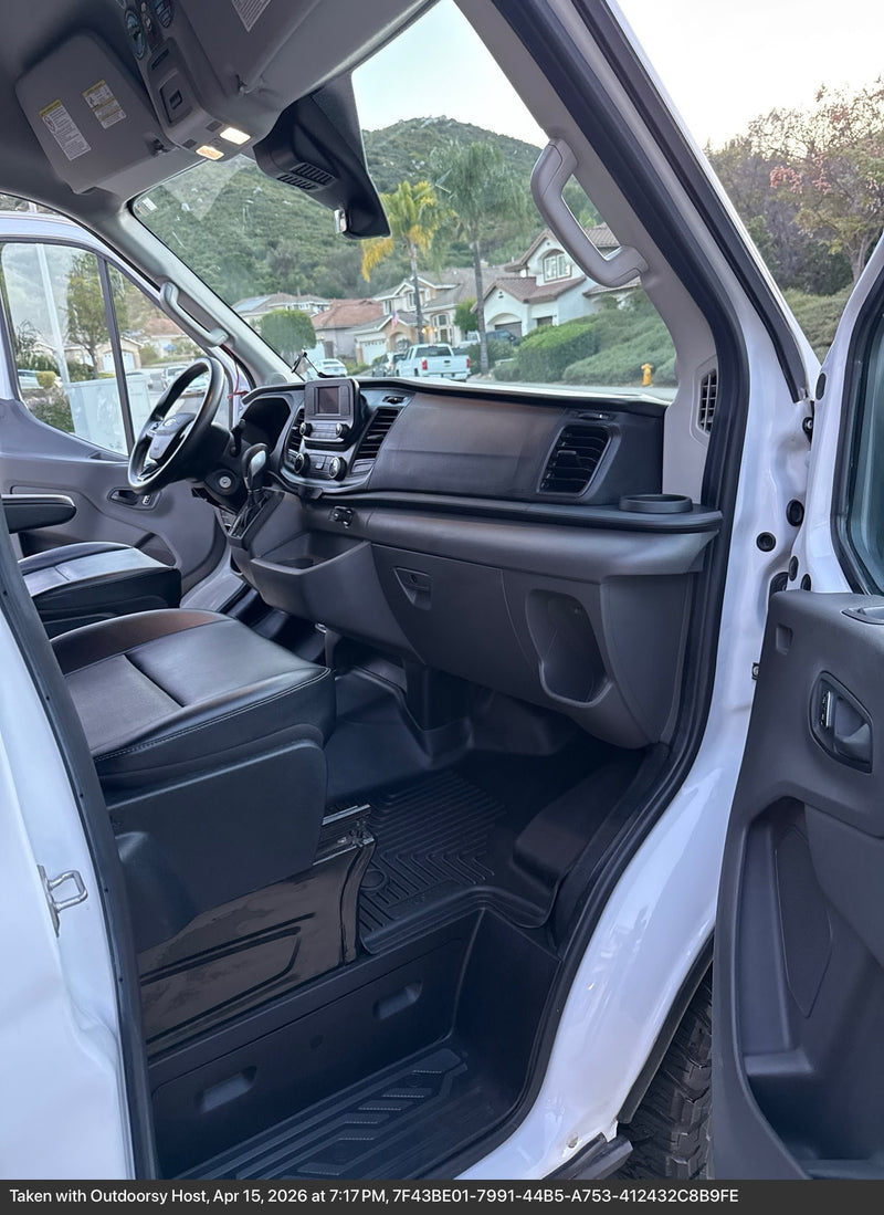  and rain-streaked windows. Detailed view of mobile living space.|White Ford Transit **rv rental** van with rugged BFGoodrich off-road tires and fender flares.|Cozy rv rental interior featuring a wooden ceiling — photo 15