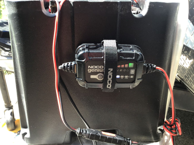 NOCO Genius battery charger on an RV battery box, crucial for RV rental power maintenance. — photo 8