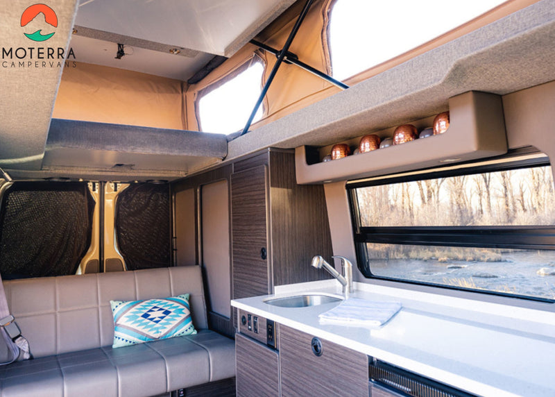 Explore in comfort! This RV rental features a modern interior with kitchen, pop-top bed, and beautiful river views. — photo 6
