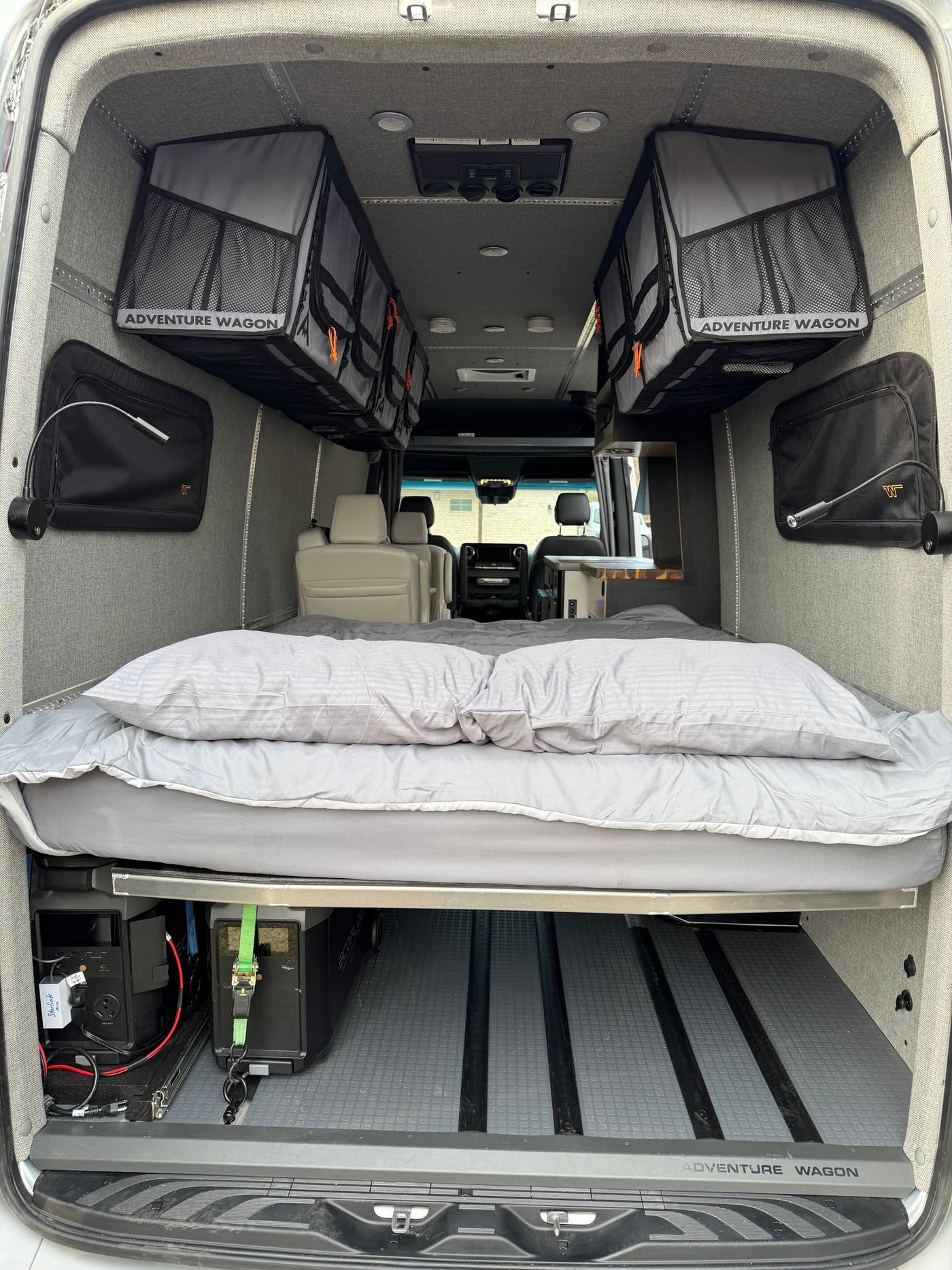 Adventure-ready RV rental: comfy bed, Adventure Wagon storage, and Ecoflow power beneath for your next journey. — photo 16