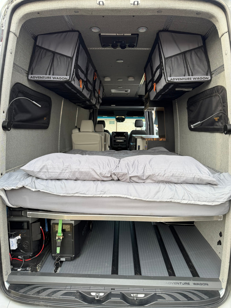 Adventure-ready RV rental: comfy bed, Adventure Wagon storage, and Ecoflow power beneath for your next journey. — photo 16