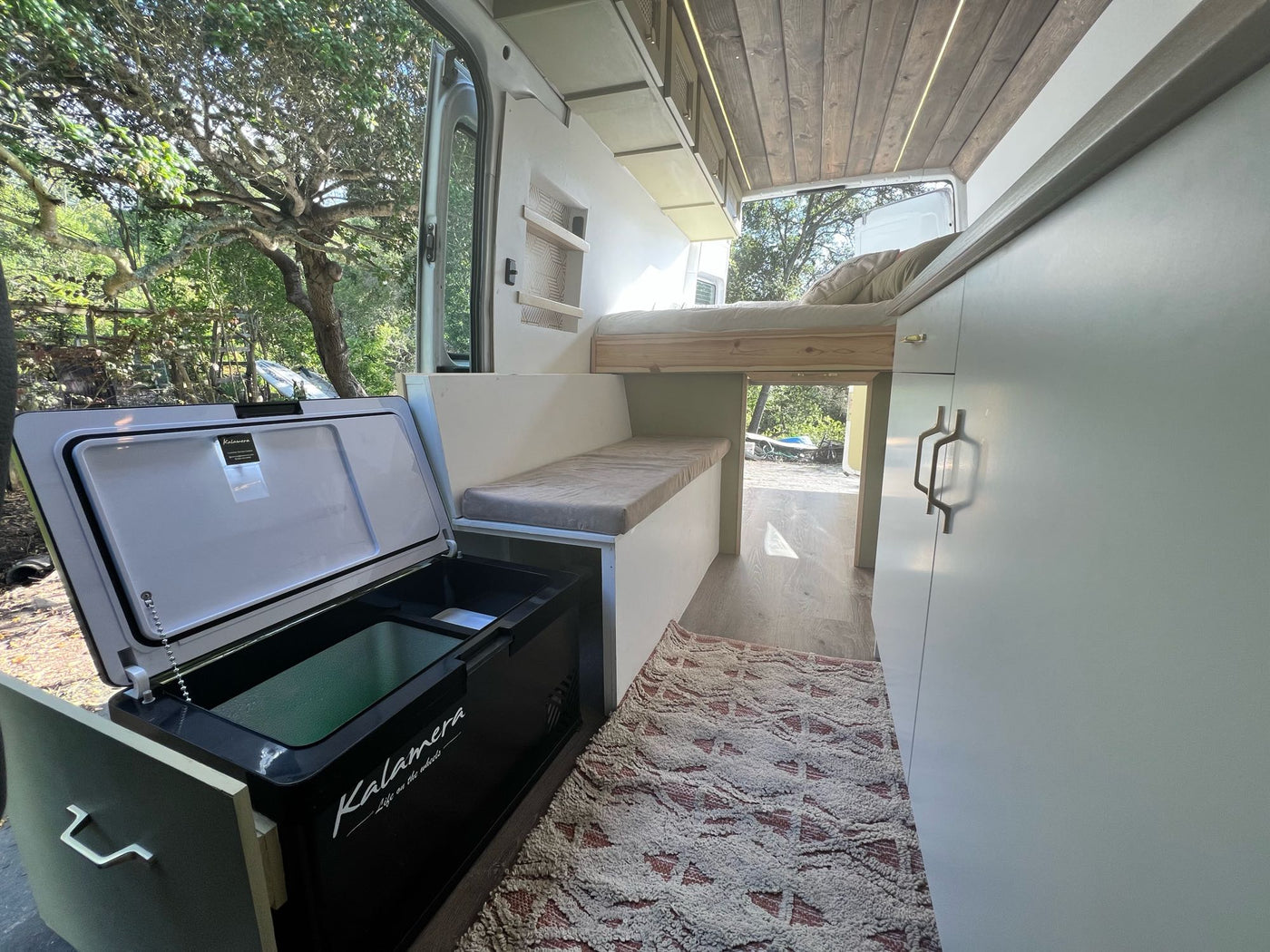  and skylight.|Discover this spacious RV rental! A beautifully converted van with a cozy bed — photo 4
