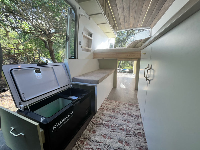  and skylight.|Discover this spacious RV rental! A beautifully converted van with a cozy bed — photo 4