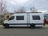White Mercedes Sprinter camper van for RV rental, featuring a roof rack and side ladder.