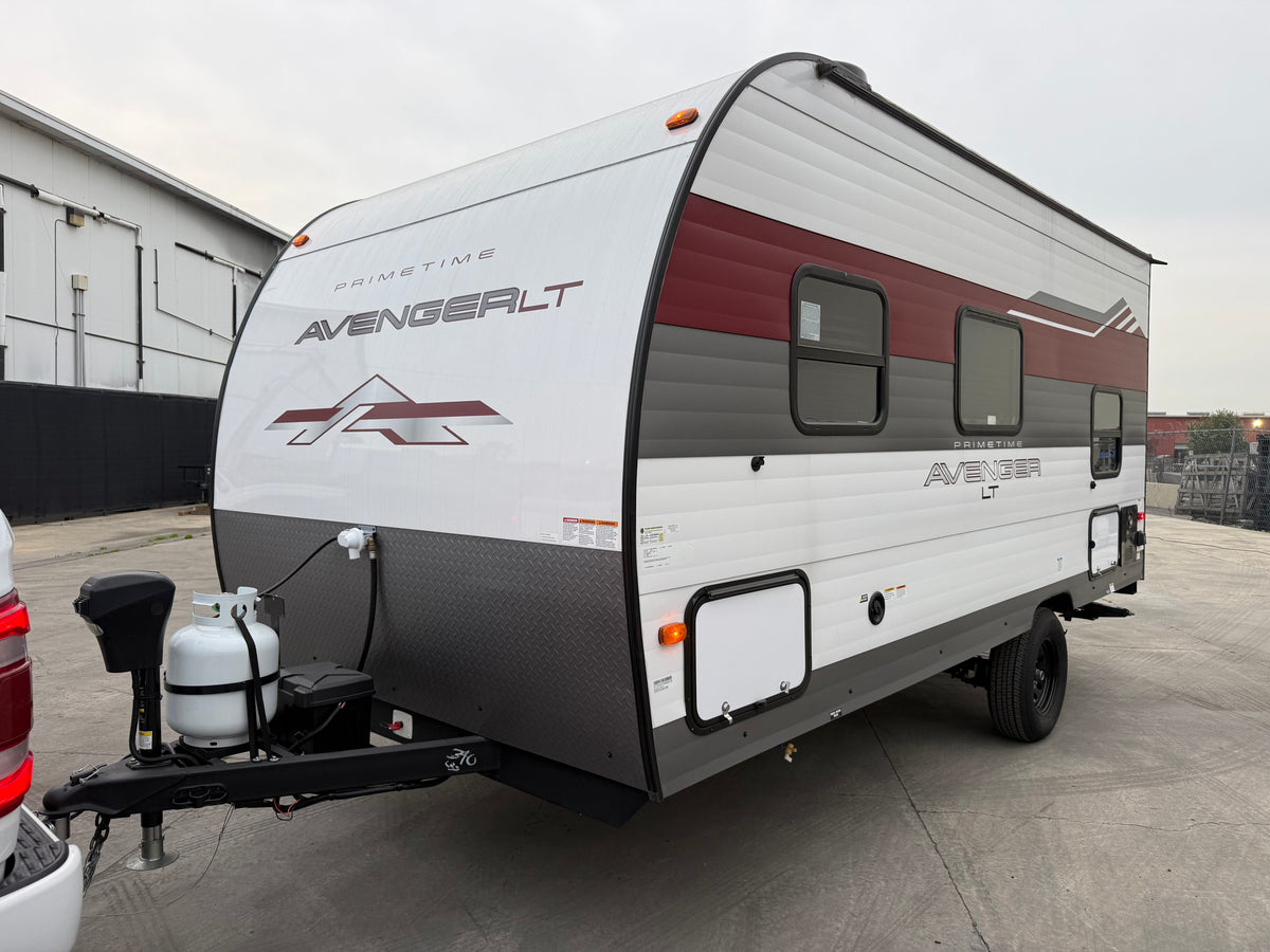 White and maroon Primetime Avenger LT travel trailer, ready for your next rv rental adventure. This compact recreational vehicle is ideal for camping. — photo 17