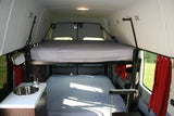 Inside this **rv rental**, find efficient bunk beds, a compact kitchen with sink, and smart storage for travel.