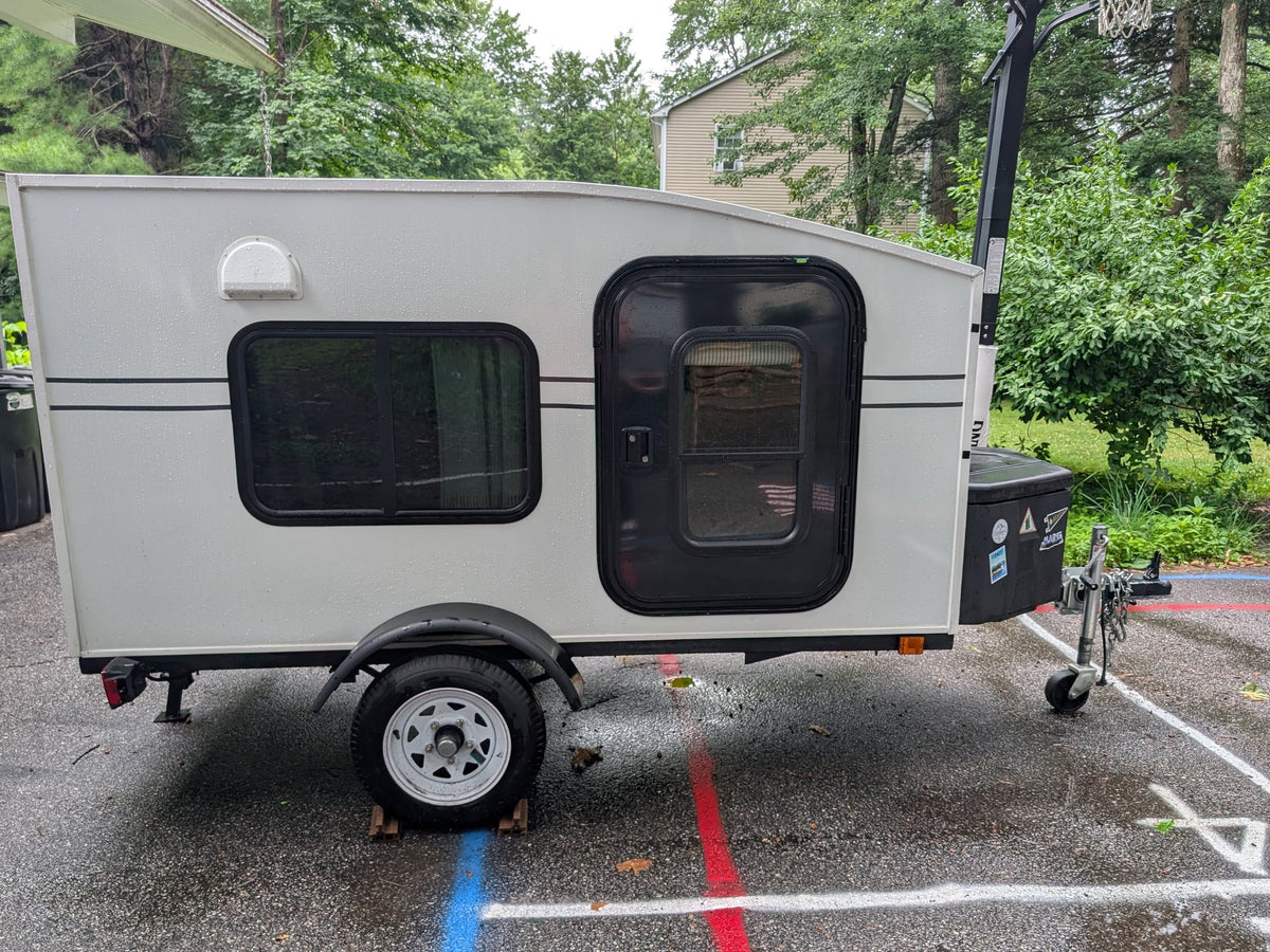 This white teardrop RV rental