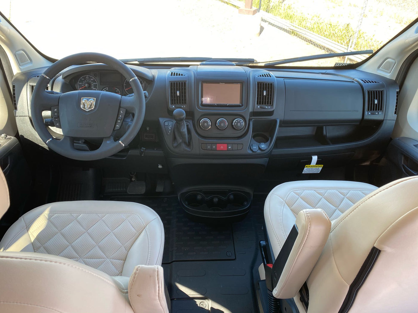  and comfortable seating.|Inviting RV rental interior with comfortable twin beds — photo 13