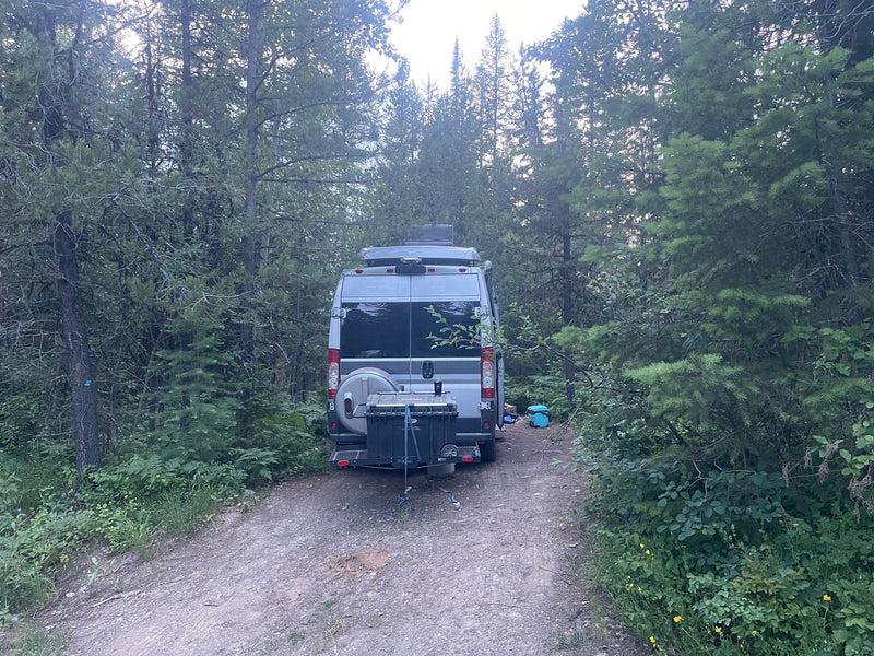  mountains in background. Perfect for travel & camping.|RV rental parked on a dirt forest road — photo 2