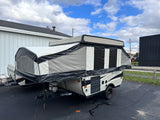 Palomino pop-up camping trailer, an ideal RV rental for outdoor leisure and travel.